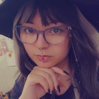 a woman wearing glasses and a witch hat